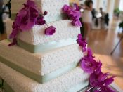 5 tier wedding cake purple flowers close up