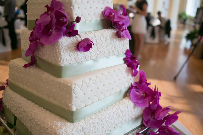 5 tier wedding cake purple flowers close up